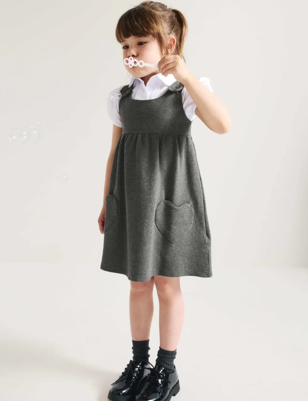 2 Pack Girls' Jersey Bow School Pinafores (2-12 Yrs)